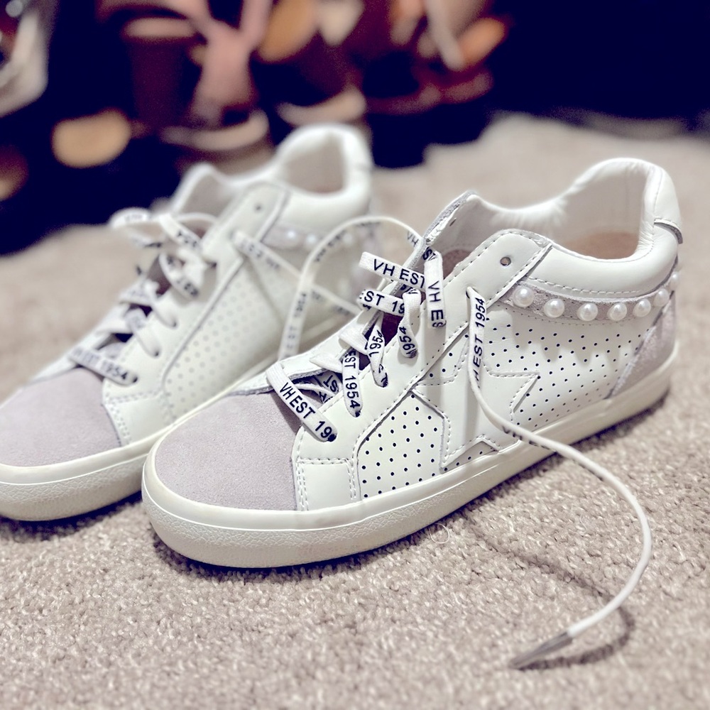 These are high tops with pearls embellishments. Perfect for any outfit!